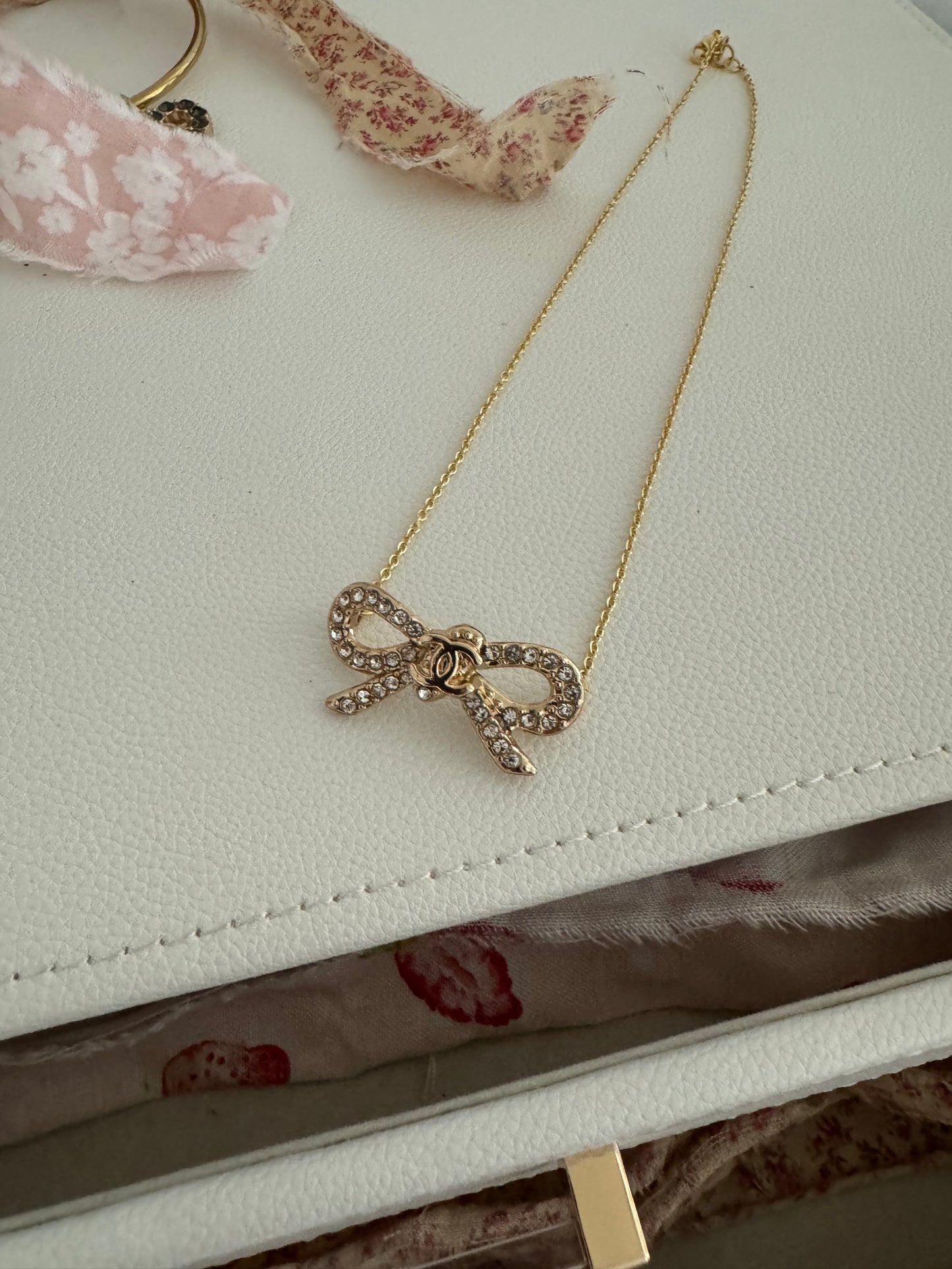 Pave bow necklace